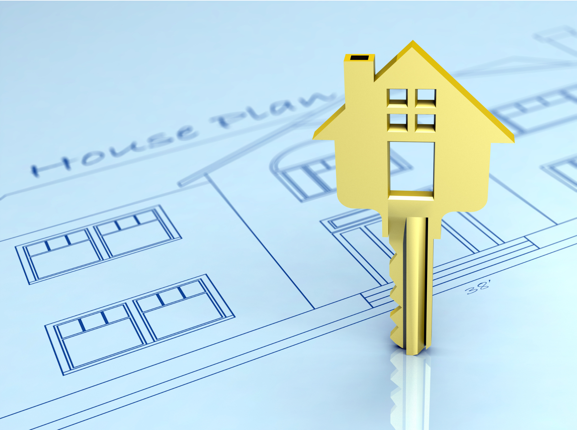 Residential building permit concept with house key and blueprint